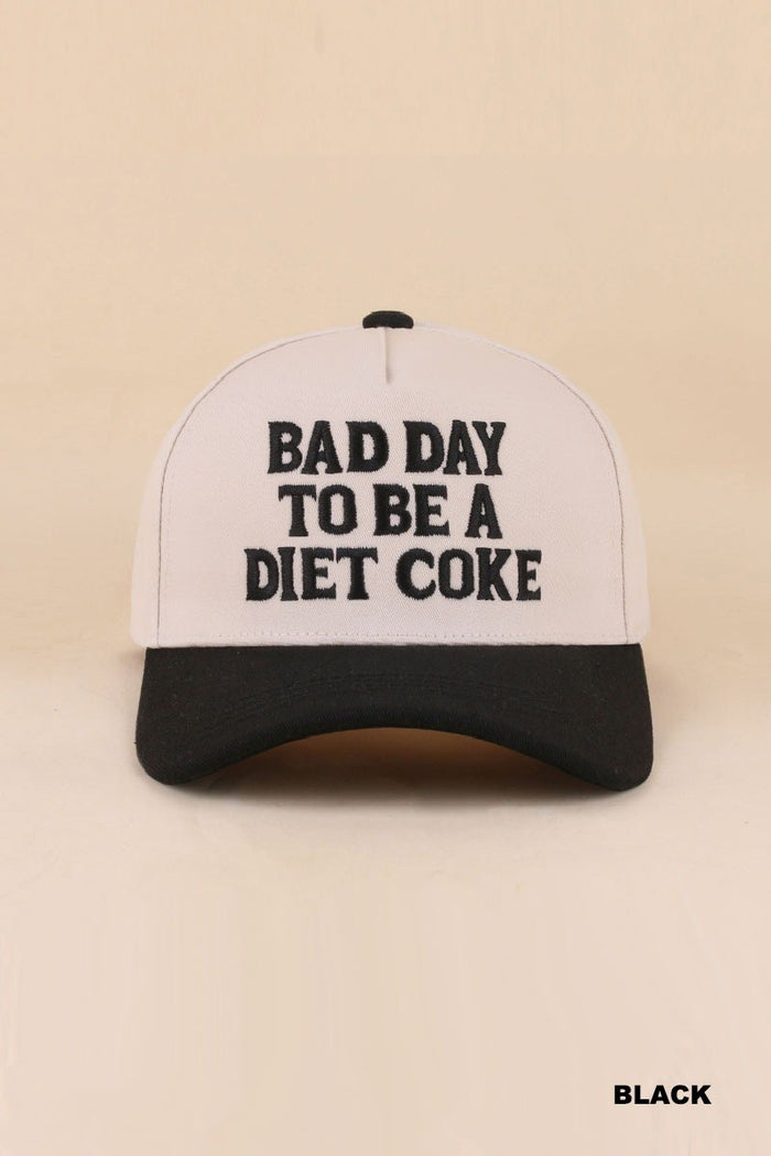 Trucker hat with 'Bad Day to be a Diet Coke' text on a beige background