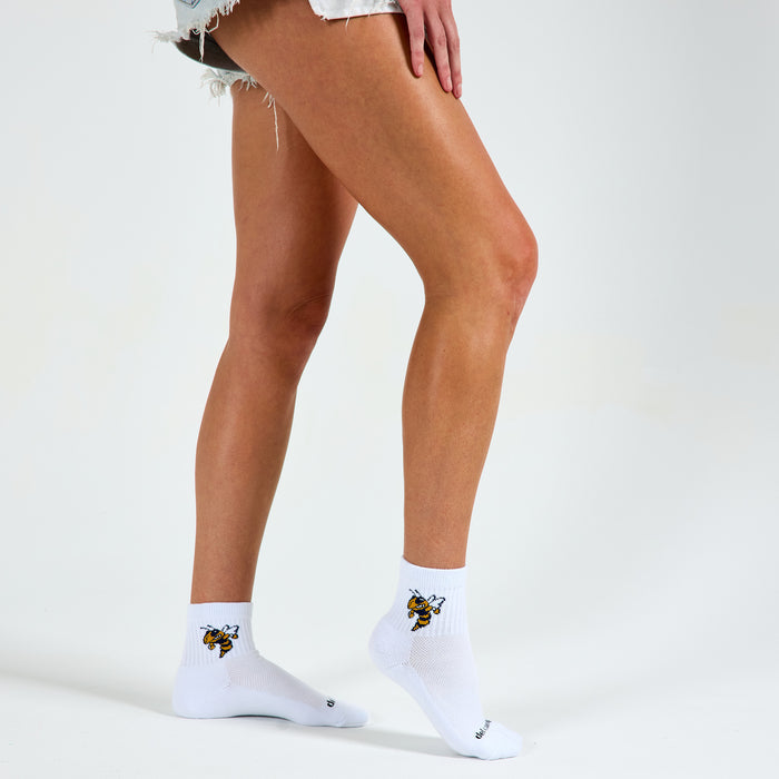 Del Campo Georgia Tech Buzz golf socks on a female model in studio