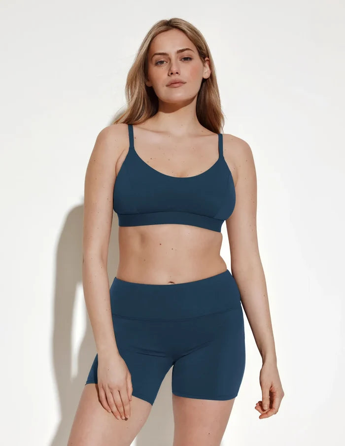 | Front view of model wearing the Leakproof Sculpt Long Swim Short highlighting the coverage and fit | Horizon