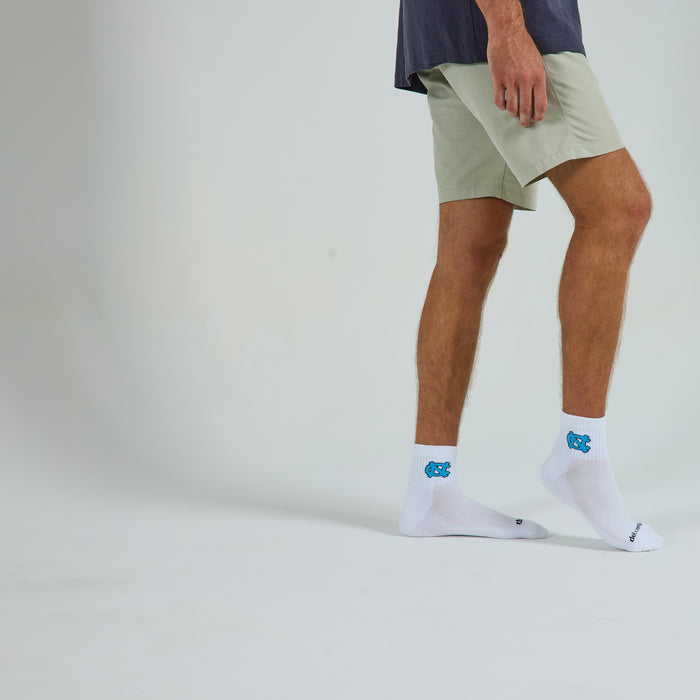 Del Campo North Carolina Interlocking NC golf socks on a male model in studio