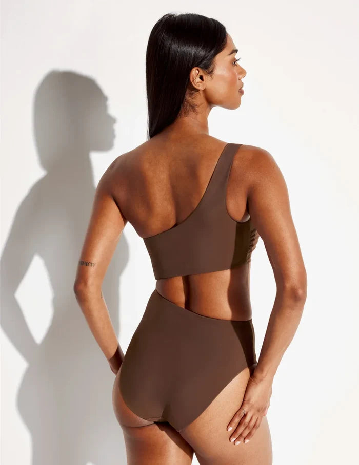 | Back view of model wearing the Sculpt One Shoulder One Piece Swimsuit highlighting the neckline, coverage and fit | Espresso