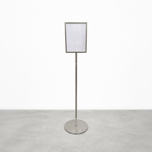 Stainless steel pole sign with a rectangular menu frame and round base.