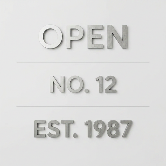 Dimensional aluminum lettering samples reading Open, No. 12, and Est. 1987.