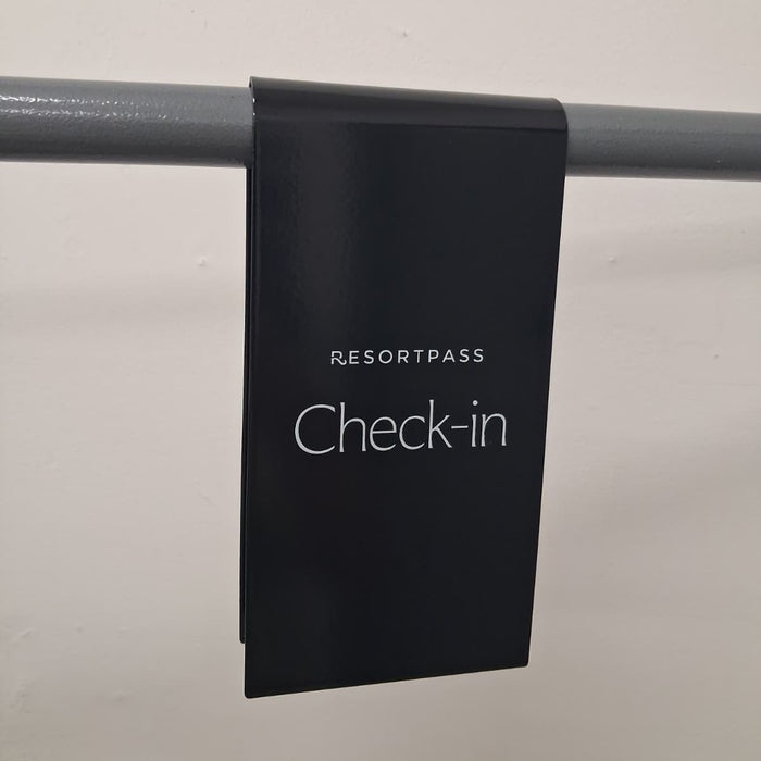 Front view of a black ResortPass Check-in sign clip on a rail.