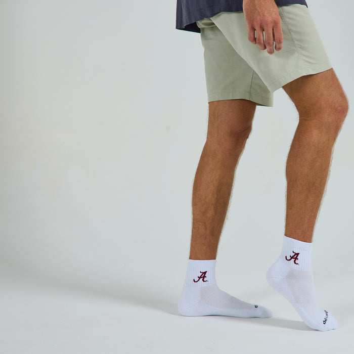 Del Campo Alabama Crimson Tide golf socks on a male model in studio