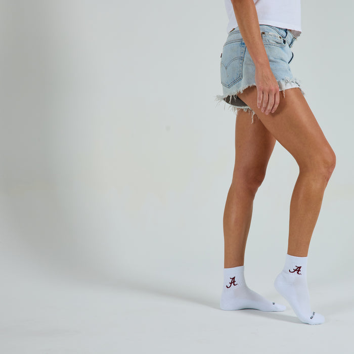 Del Campo Alabama Crimson Tide golf socks on a female model in studio