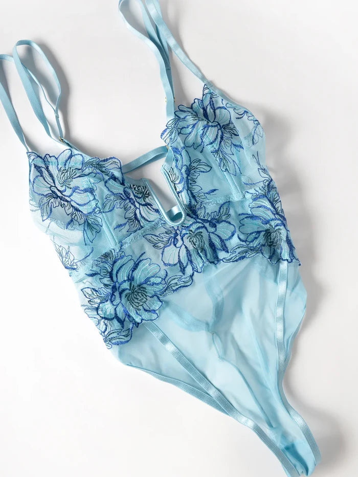 Blue floral bodysuit on a white background