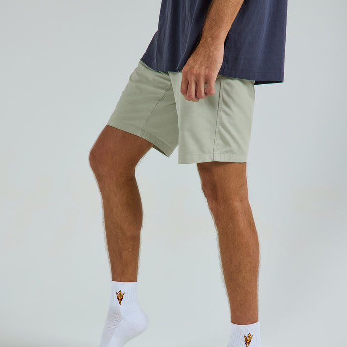 Male model in Del Campo Arizona State Sun Devils golf socks, studio backdrop