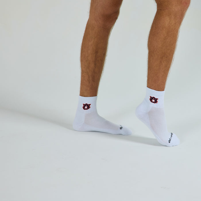 Man wearing Del Campo Auburn War Eagle golf socks, studio shot, no shoes