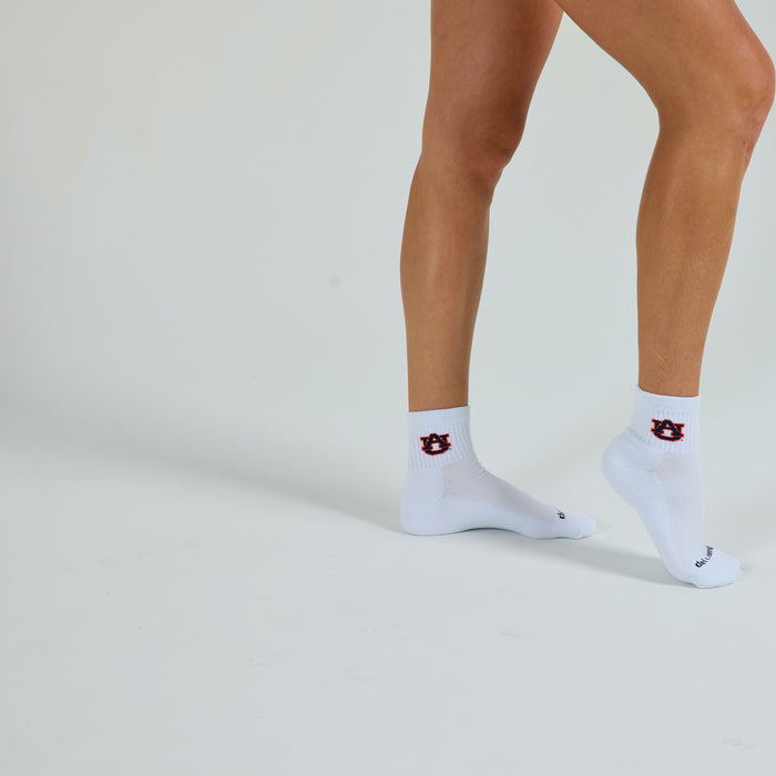 Woman wearing Del Campo Auburn War Eagle golf socks, studio shot, no shoes
