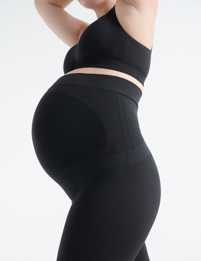 Ashleigh wears a size L | Front view of model wearing the BlissFit™ Maternity Legging highlighting the coverage & fit | Black