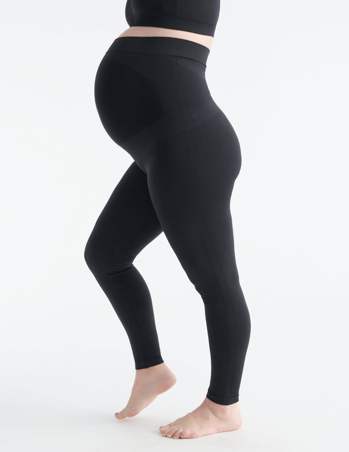 Ashleigh wears a size L | Front view of model wearing the BlissFit™ Maternity Legging highlighting the coverage & fit | Black