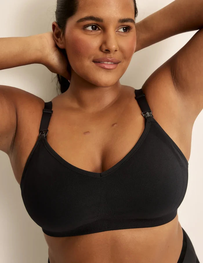 Adiya is a 36C and wearing KNIX L | Front view of model wearing the BlissFit™ Nursing/Pumping Bra, highlighting the neckline, nursing clip strap design, and smooth silhouette | Black