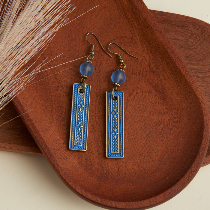 western inspired blue pendant style earrings