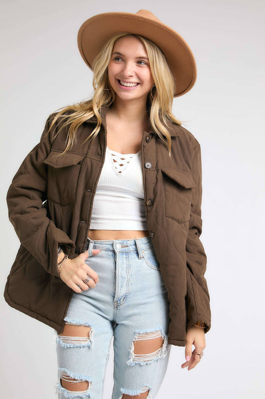 brown puffy quilted style button up jacket.  With 2 chest pockets and side hand pockets too