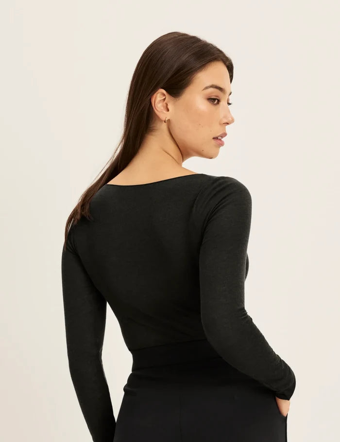 | Back view of model wearing the Cashmere Mist Boatneck Top highlighting the neckline and fit | Black