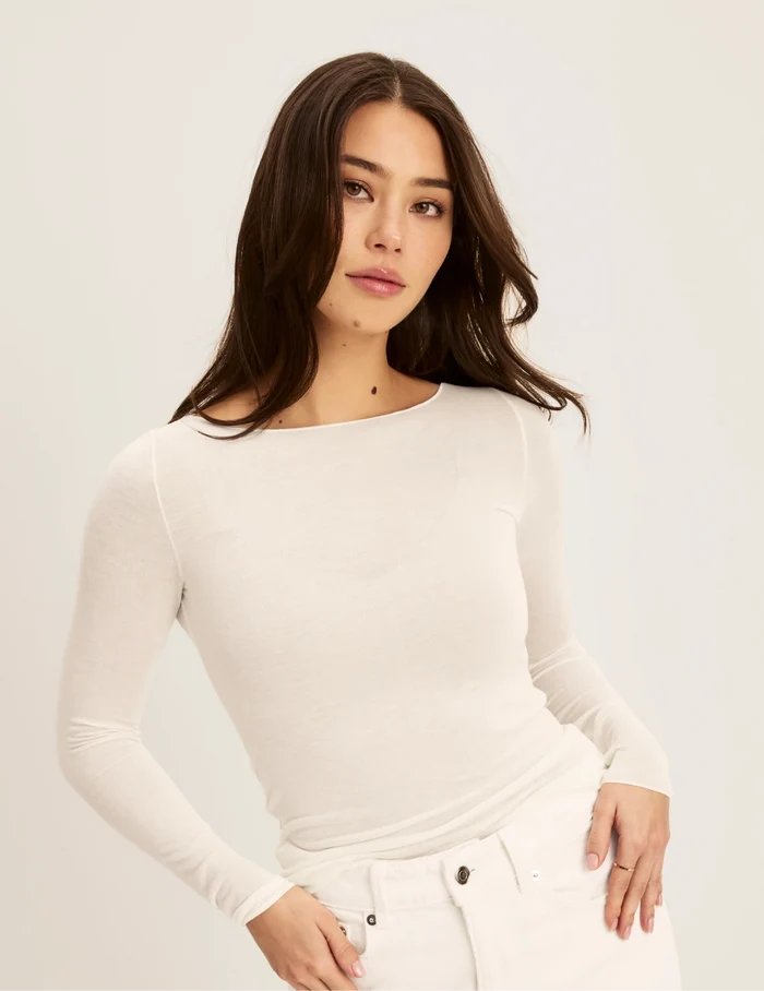 | Front view of model wearing the Cashmere Mist Boatneck Top highlighting the neckline and fit | Ivory