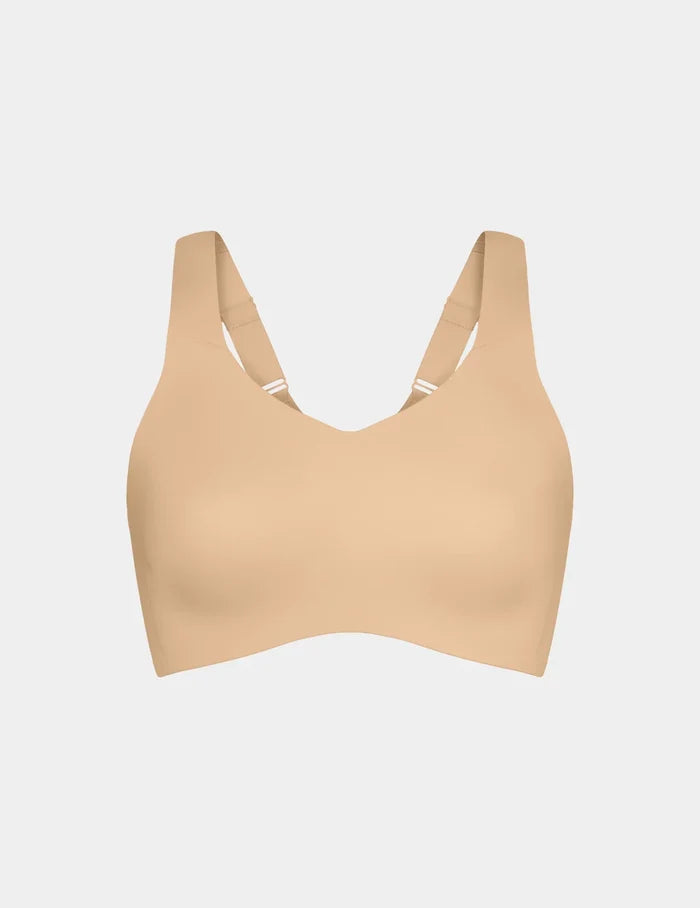 | View of Catalyst Sports Bra shown front-facing against a light gray background | Warm Sand