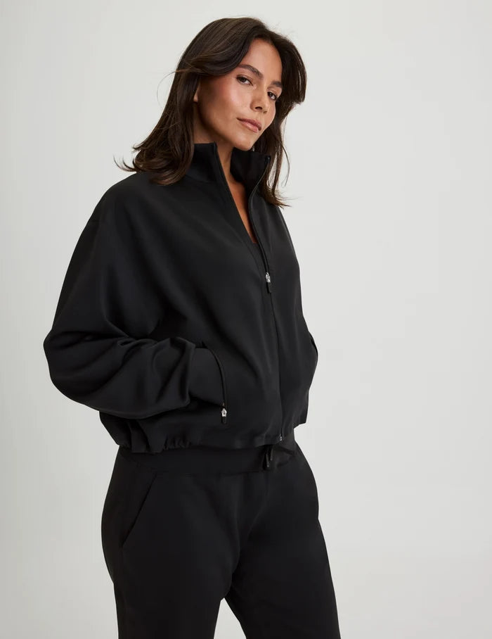 | Front view of model wearing the CloudCut™ Bomber highlighting the coverage and fit | Black