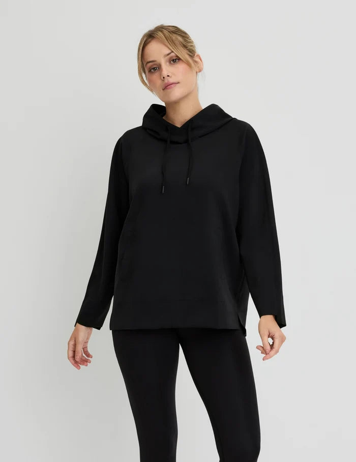 | Front view of model wearing the CloudCut™ Hoodie highlighting the coverage and fit | Black