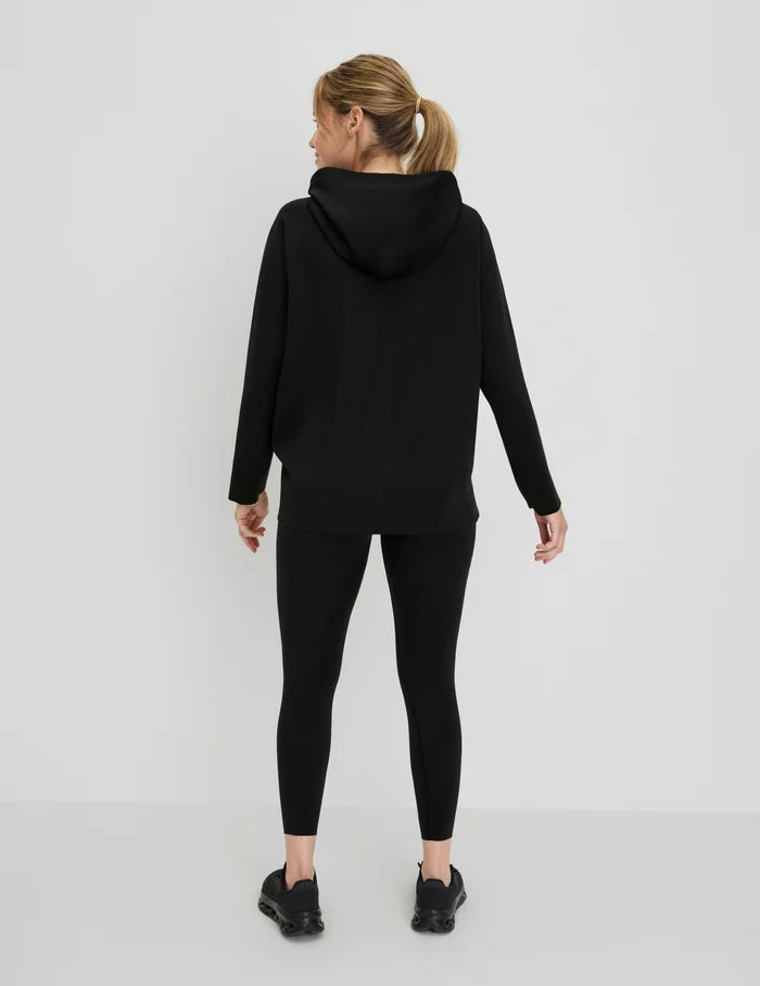 | Back view of model wearing the CloudCut™ Hoodie highlighting the coverage and fit | Black