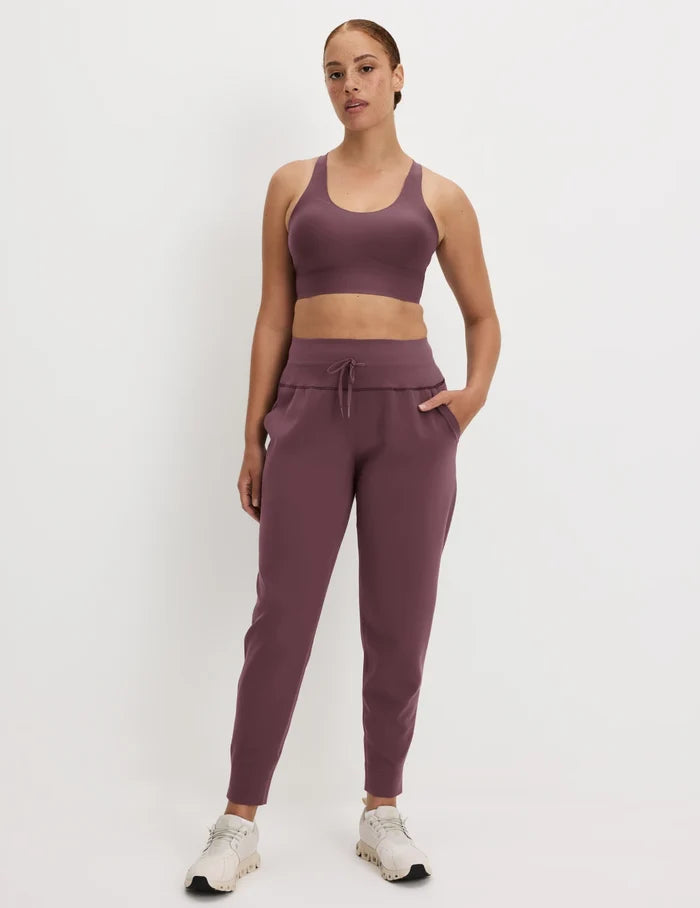 | Front view of model wearing the CloudCut™ Jogger highlighting the coverage and fit | Dahlia