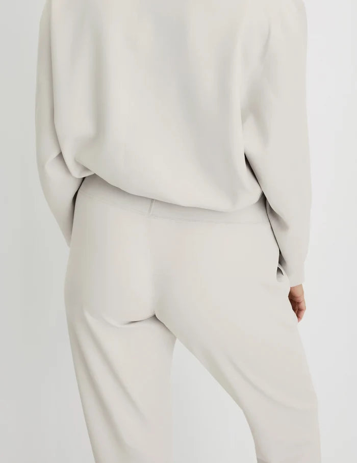 | Back view of model wearing the CloudCut™ Jogger highlighting the coverage and fit | Sphere