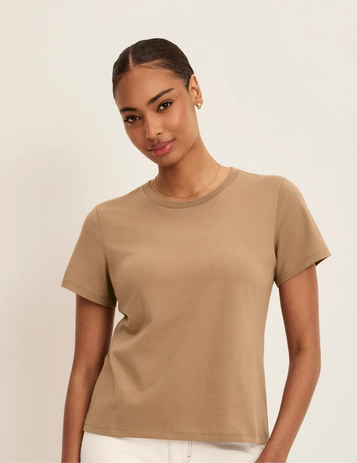 | Front view of model wearing the Cotton Relaxed T-Shirt highlighting the coverage and fit | Cashew