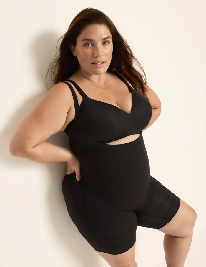 Clementine is a 40G, has 51" hips, is 5'9.5" tall and wears a size XXL  | Front view of model wearing the Customizable Open Bust Shaper Bodysuit highlighting the coverage and smooth fit | Black