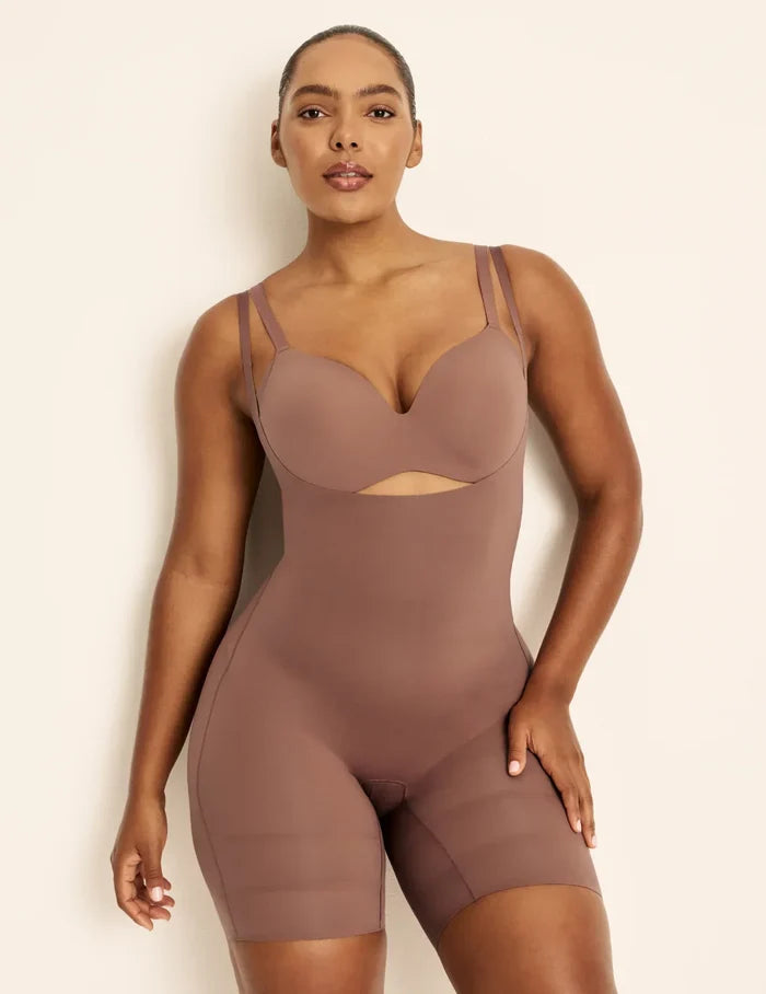 Amber is a 36C, has 46” hips, is 5’10.5” tall and wears a size L  | Front view of model wearing the Customizable Open Bust Shaper Bodysuit highlighting the coverage and smooth fit | Sola