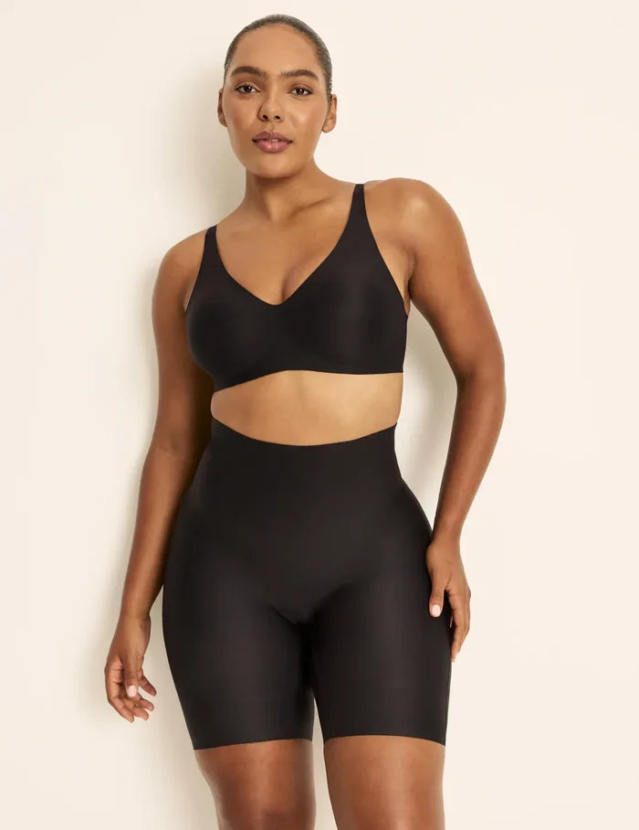 Amber has 46” hips, is 5’10.5” tall and wears a size L  | Front view of model wearing the Customizable Shaper High Rise Leakproof Shorts, highlighting the coverage and smooth fit | Black