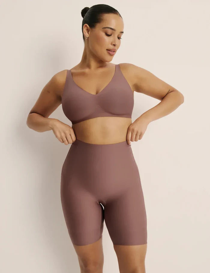 | Front view of model wearing the Customizable Shaper High Rise Shorts, highlighting the coverage and smooth fit | Sola