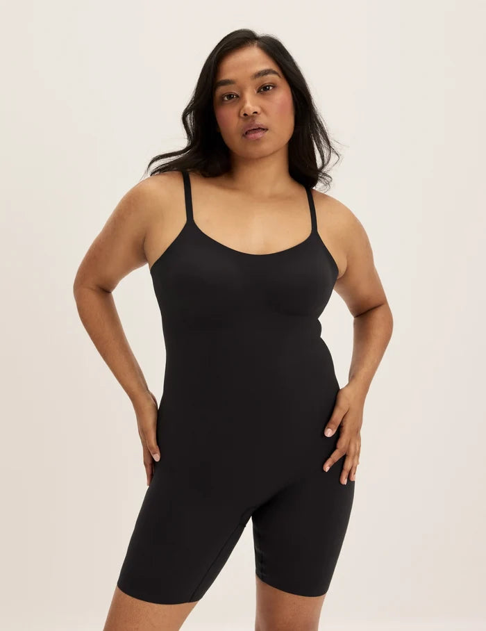 | Front view of model wearing the Customizable Shaper Mid-Thigh Bodysuit highlighting the coverage and smooth fit | Black