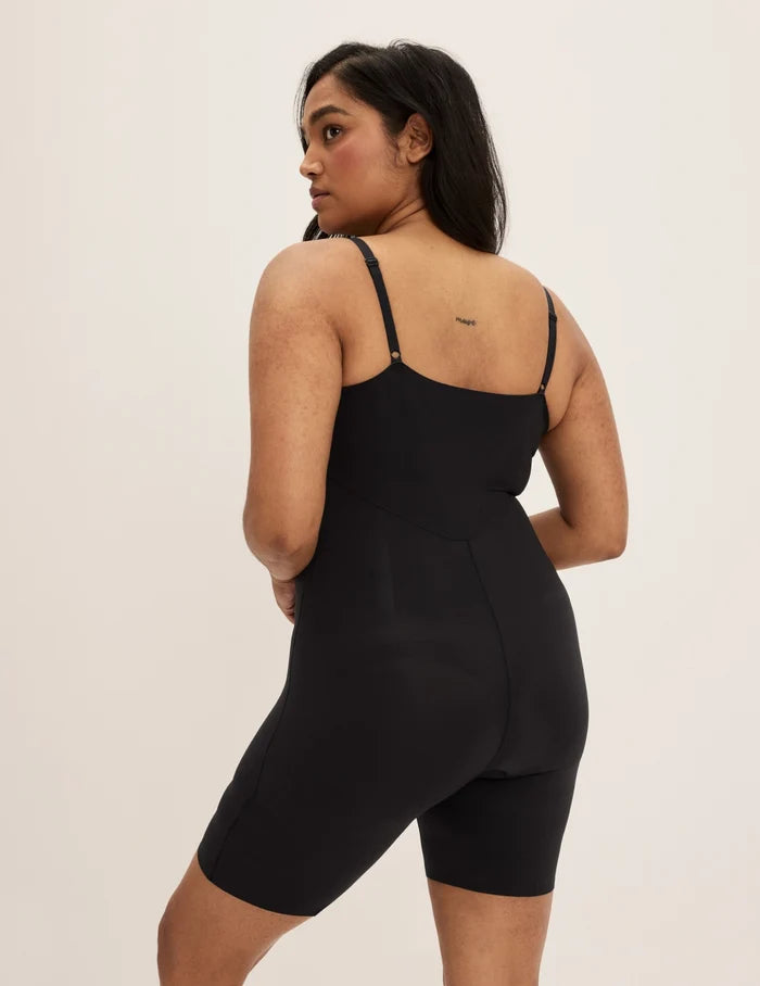 | Back view of model wearing the Customizable Shaper Mid-Thigh Bodysuit highlighting the coverage and smooth fit | Black