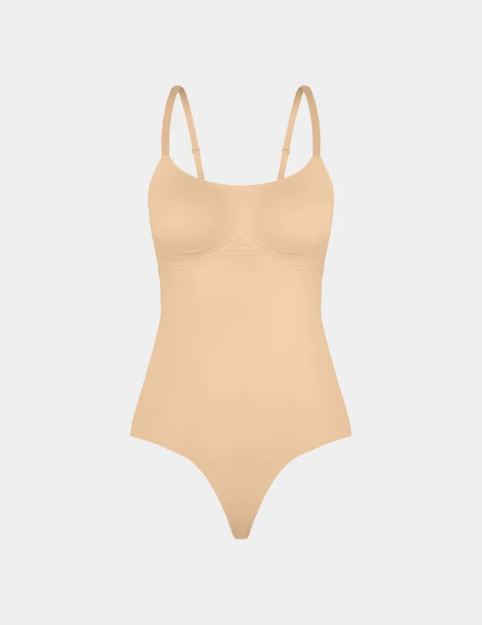 | Customizable Shaper Thong Bodysuit shown front-facing against a light gray background | Warm Sand