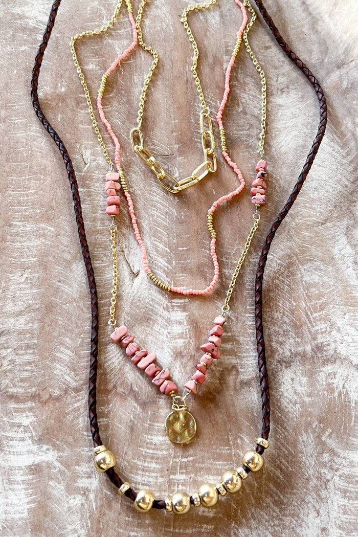 layer long necklace. Has beads, gold chains and gold charms. Includes a lobster claw closure and 2" extender. Length of shortest layer: 20"