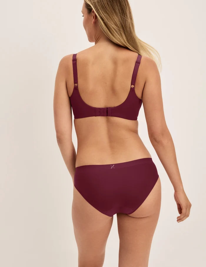 | Back view of model wearing the Essential No-Show Bikini highlighting the coverage and smooth fit | Pink Multi