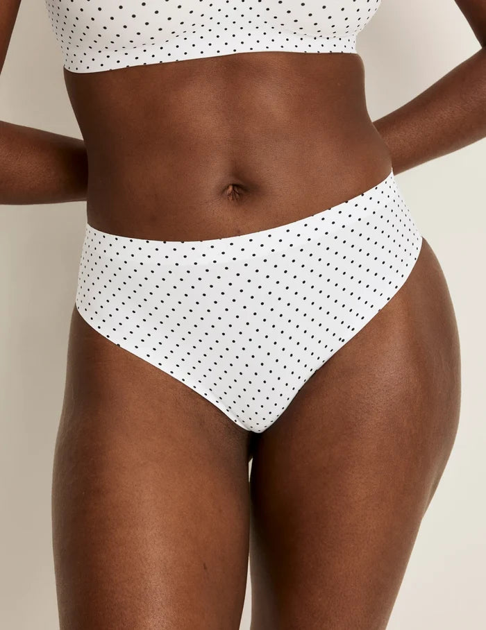 | Front view of model wearing the Essential No-Show French Cut highlighting the coverage and smooth fit | White with Black Polka Dot