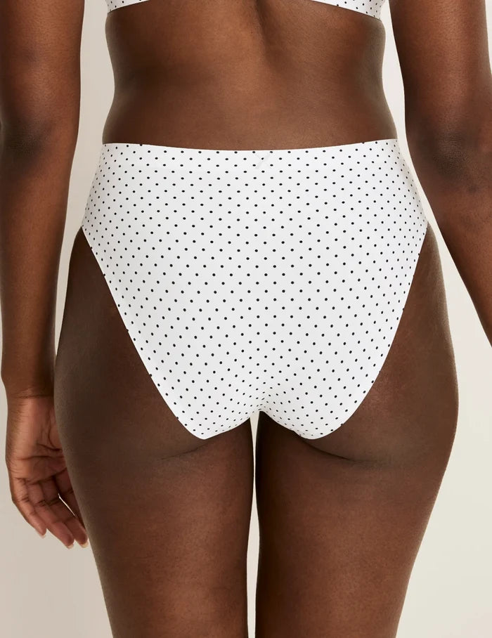 | Back view of model wearing the Essential No-Show French Cut highlighting the coverage and smooth fit | White with Black Polka Dot