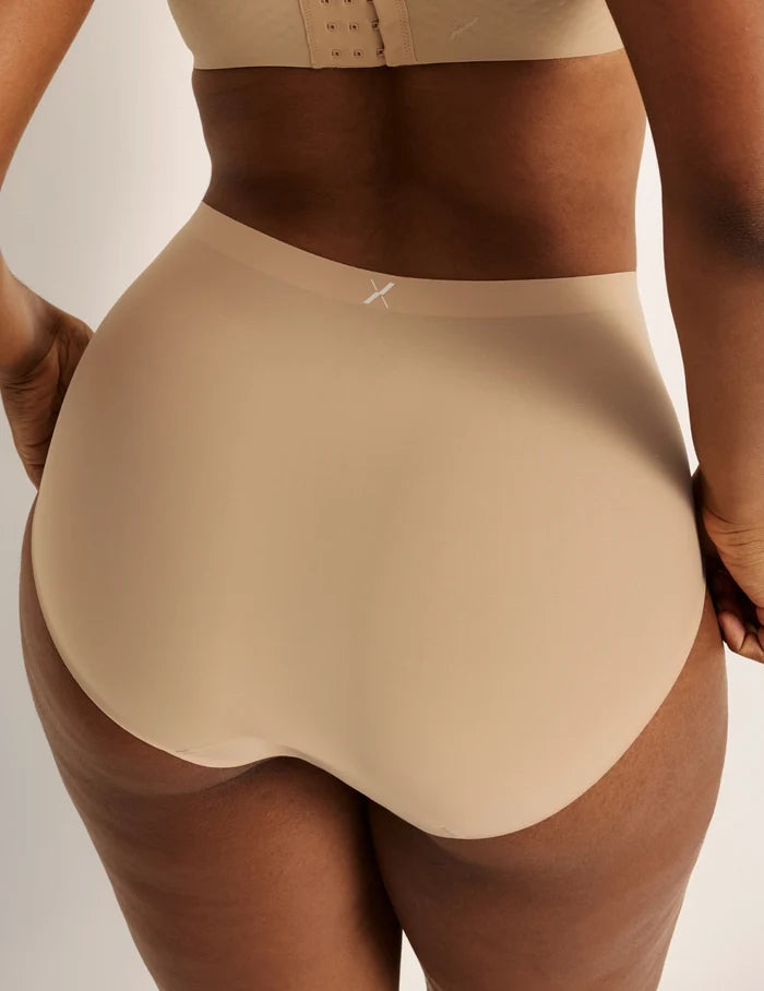 | Back view of model wearing the Essential No-Show High Rise highlighting the coverage and smooth fit | Nude Multi