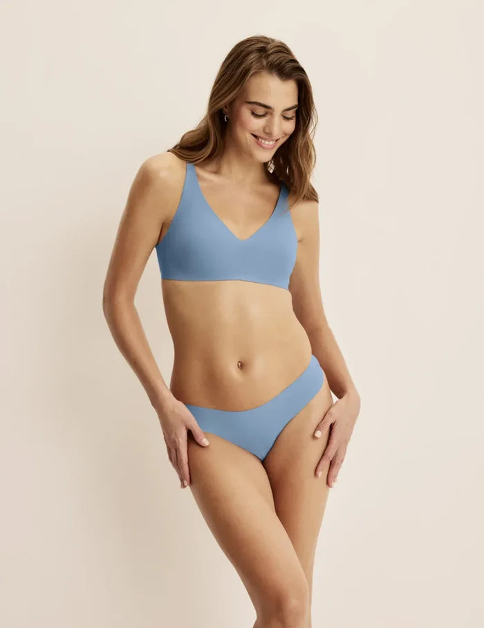 | Front view of model wearing the Essential No-Show Thong 5-Pack highlighting the coverage and smooth fit | Chambray Multi