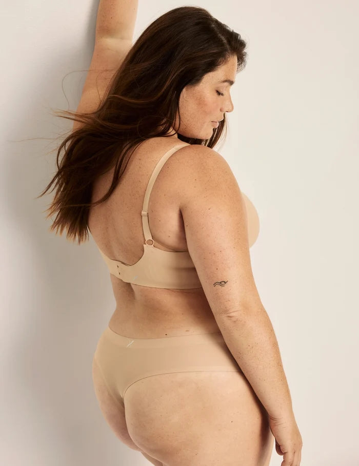 | Side view of model wearing the Essential No-Show Thong highlighting the coverage and smooth fit | Nude Multi