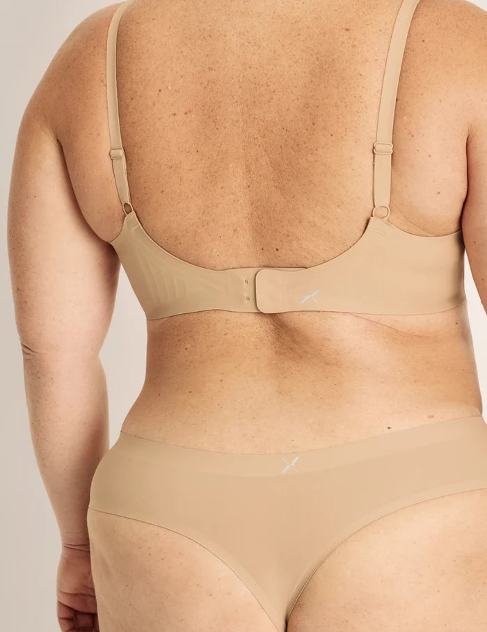 | Back view of model wearing the Essential No-Show Thong highlighting the coverage and smooth fit | Nude Multi