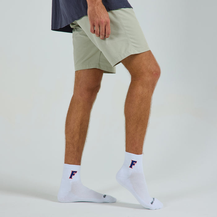 Man wearing Del Campo Florida Gators Block F golf socks, studio shot, no shoes