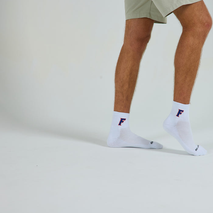 Del Campo Florida Gators Block F golf socks on a male model in studio