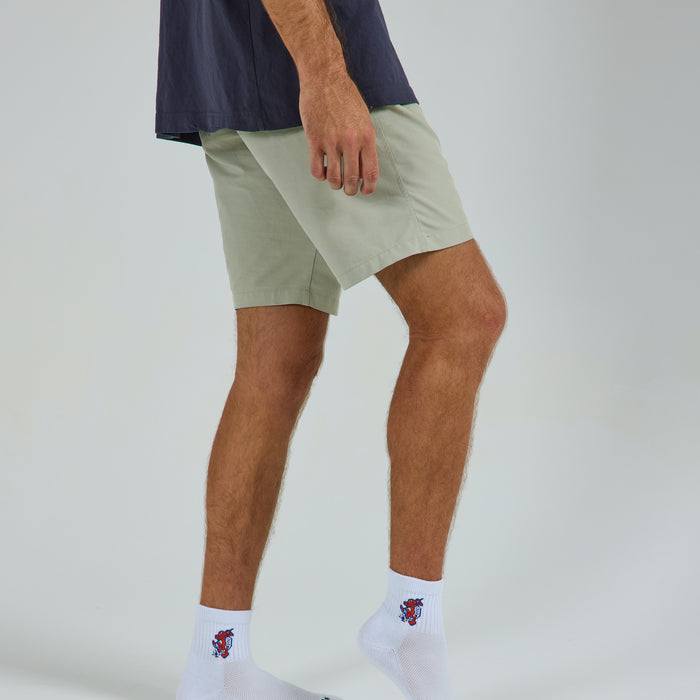 Man wearing Del Campo Florida Gators Swinging Gator golf socks, studio shot, no shoes