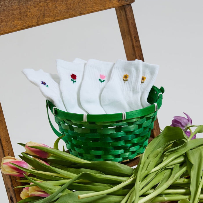 Del Campo Flower Pack golf socks featuring four floral designs: rose, sunflower, violet, and pink tulip