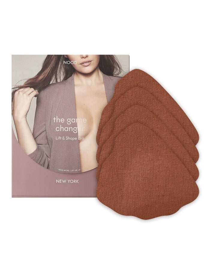 | Game Changer Lift and Shape Adhesive Bra packaging shown front-facing against a light gray background | No. 7 Bronze