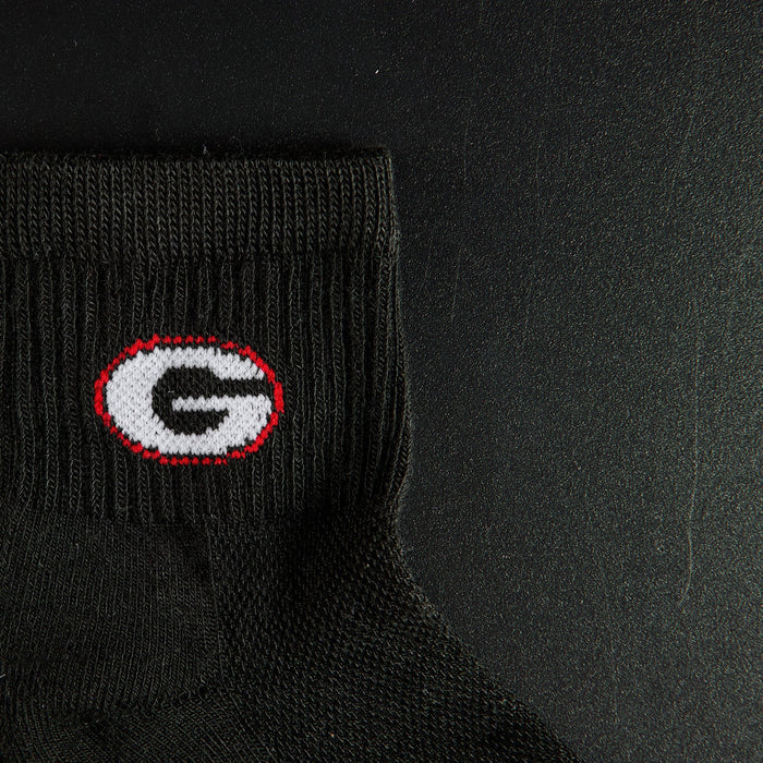 Close-up of the G on Del Campo Georgia Night Mode golf socks
