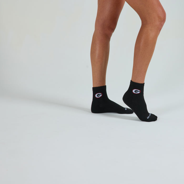 Woman wearing Del Campo Georgia Night Mode golf socks, studio shot, no shoes
